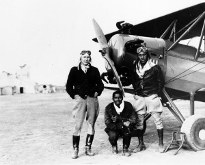 Pioneer Aero Club members Gilbert, right, and Marie, left, and a friend next to airplane at a stop between Los Angeles and San Diego, c. 1930. Shades of L.A. Collection.